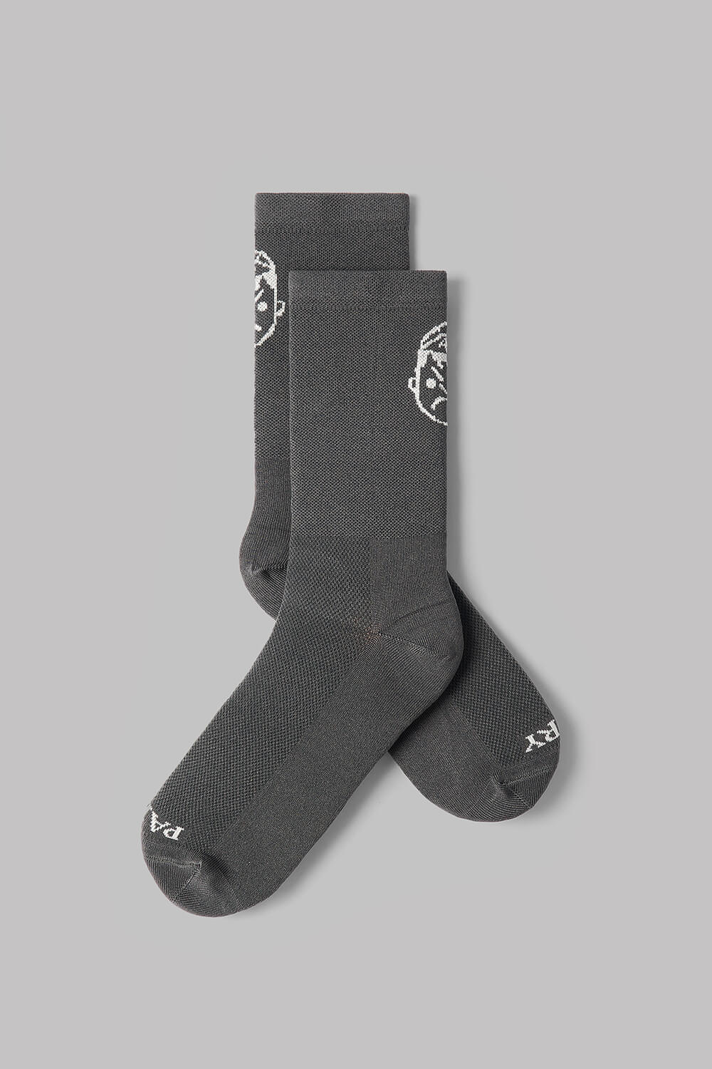 Pair of dark gray socks with a logo on a light gray background