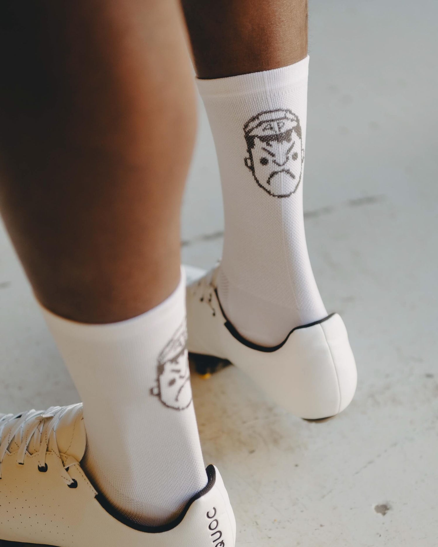 The back of a pair of Angry Pablo White Cycling Socks