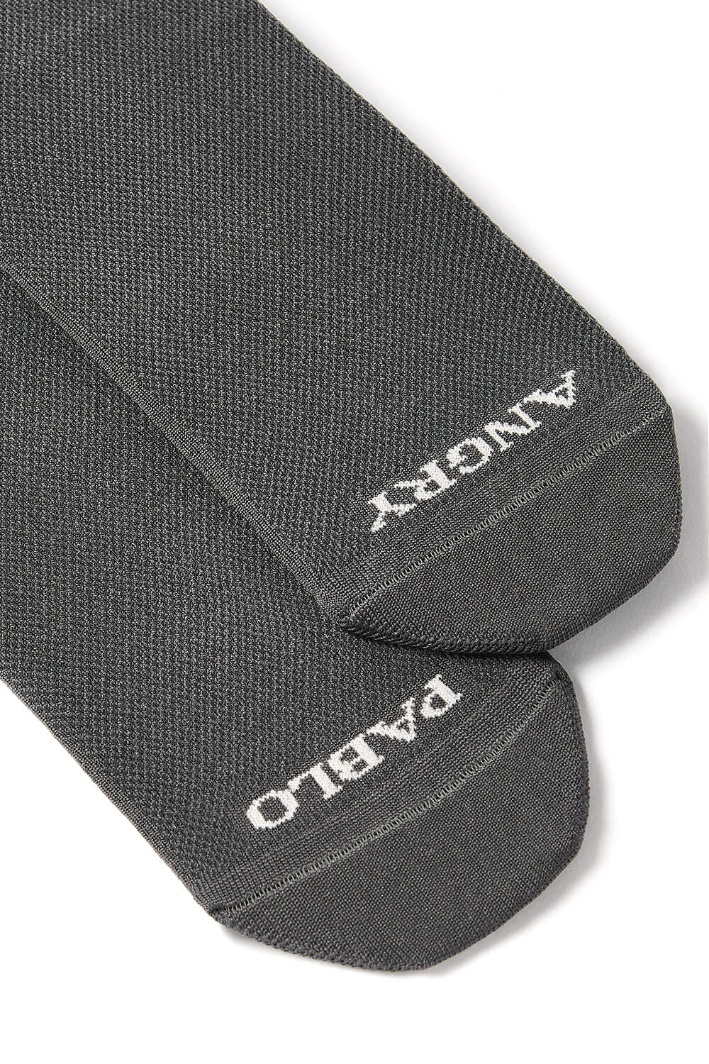 A close-up detail of the foot on the Angry Pablo High Top Grey Cycling Socks